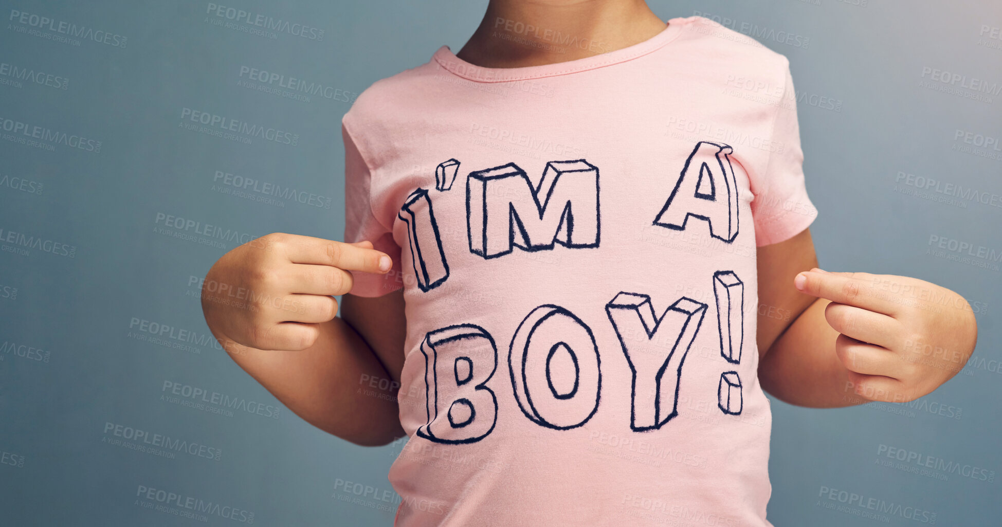 Buy stock photo Hands, child and point at text on shirt for gender identity, style and edgy fashion by background. Boy, toddler and kid model with pink clothes for choice, learning and show print with promotion