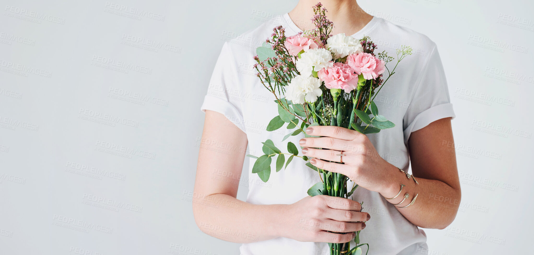 Buy stock photo Woman, hands and flowers with roses on banner for floral, anniversary or gift on a white studio background. Closeup of female person with plant, leaves or stem for romance, present or love on mockup