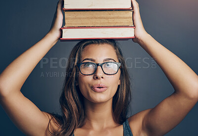 Buy stock photo Student, head and balance books for learning, education or studying isolated on studio background. Woman, university and thinking of research with textbook stack for knowledge, info or scholarship