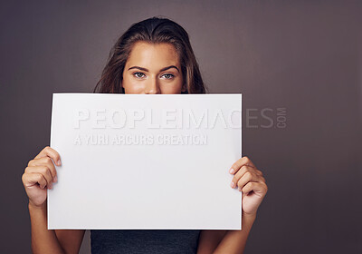 Buy stock photo Woman, portrait and studio background with board for mockup, idea for advertising or social media billboard. Female person, backdrop and empty poster for information, news notification or promotion