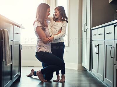 Buy stock photo Love, mother and hug for daughter, kitchen and bonding in weekend, house and kid with smile for parent. Home, child and mom with embrace, care and together in morning, peace or happiness in apartment