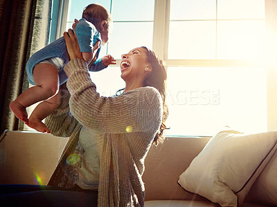 Buy stock photo Embrace, mother and infant on sofa in living room with love for relationship with new born, care and playing. Light, happy and relax with baby bonding, happiness and wellness on couch with child.