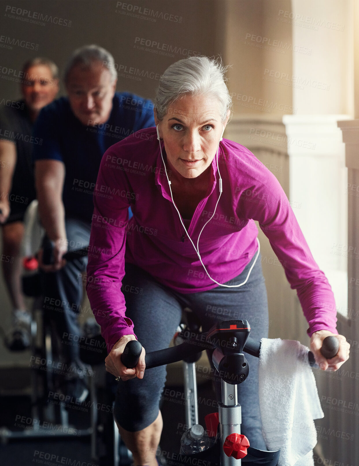 Buy stock photo Senior, gym or woman on cycling bike in workout or cardio training for endurance, health or wellness. Class, exercise or elderly sports person on bicycle machine for fitness, challenge and energy