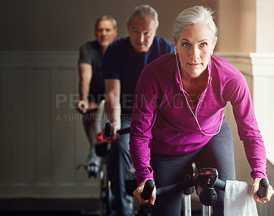 Buy stock photo Spin class, gym or senior woman on bike in workout or training for cycling progress, health or wellness. Group, challenge or confident elderly person on bicycle machine for fitness or cardio exercise