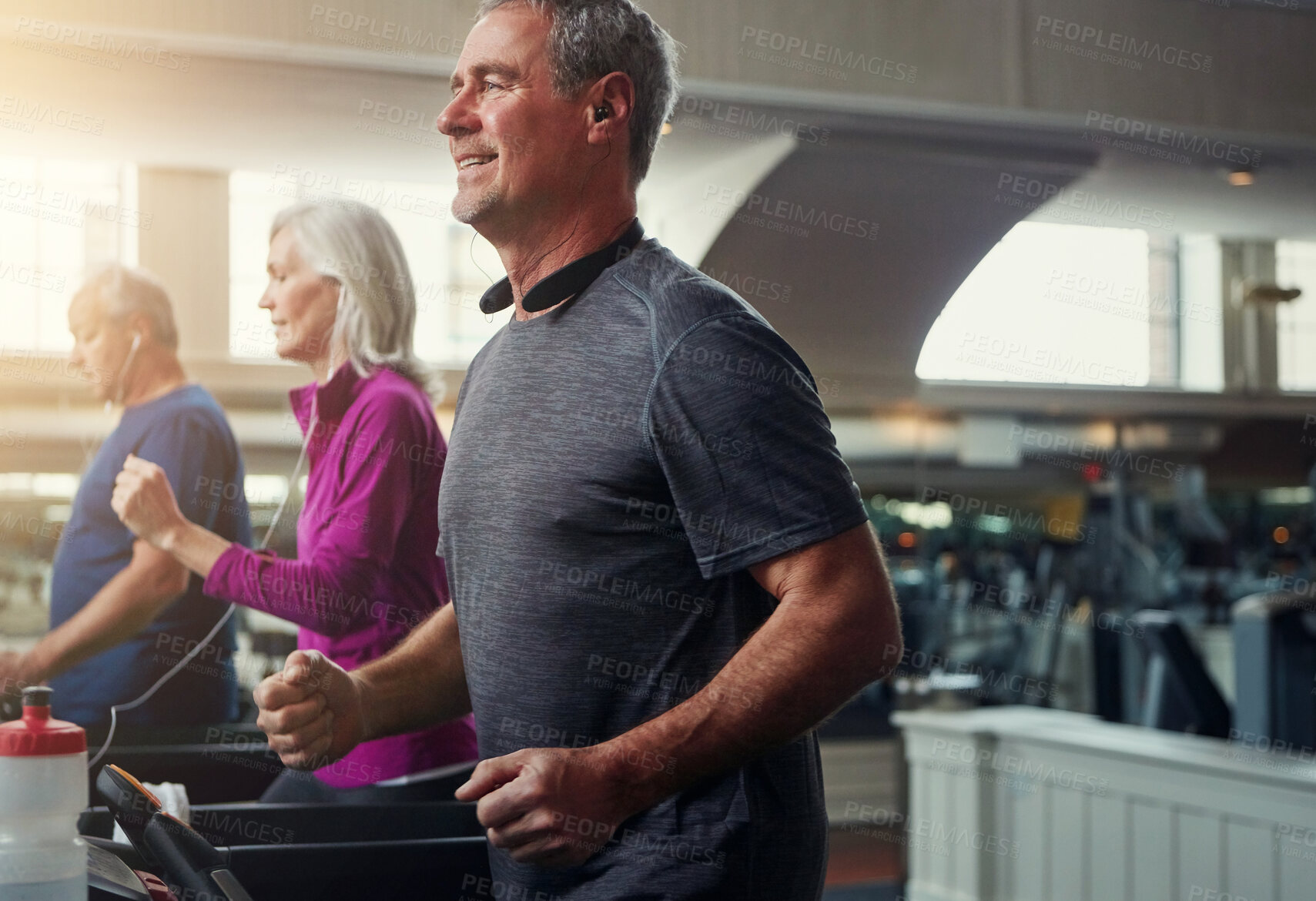 Buy stock photo Exercise, treadmill and senior people running in gym for workout, physical health and wellness in retirement. Group, jogging or training together for cardio, walking and fitness or endurance