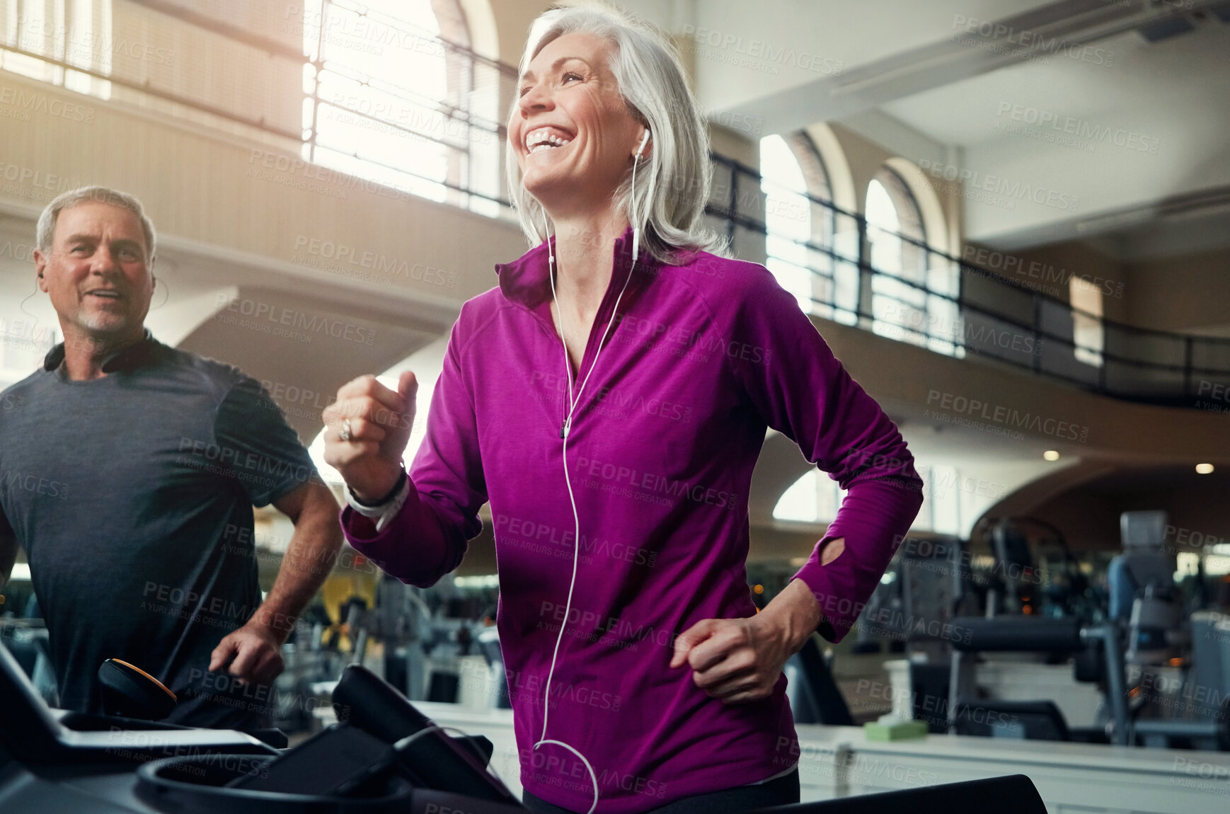 Buy stock photo Fitness, running and mature woman on treadmill in gym for health, wellness and body exercise. Smile, athletes and friends on cardio equipment for endurance workout or training in sports center