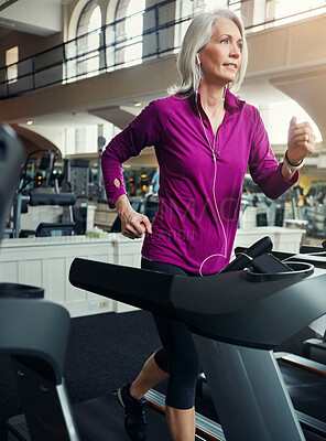 Buy stock photo Senior woman, running on treadmill and training with fitness in gym, cardio and breathing for health and wellness. Person, female runner and exercise equipment, mature and workout by speed machine