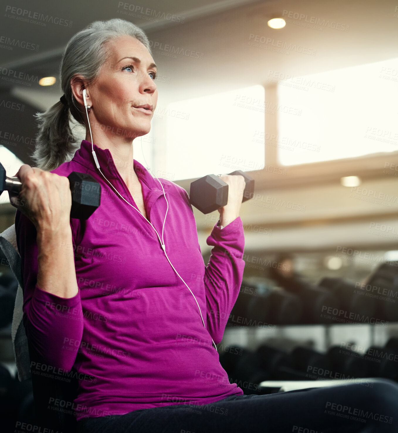 Buy stock photo Breathing. dumbbell and fitness with mature woman on bench in gym for physical training or workout. Exercise, health and music with confident athlete person in performance club for active challenge