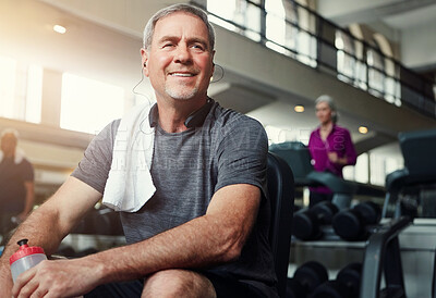 Buy stock photo Fitness, headphones and old man relax in gym with water bottle for training, exercise and workout. Sports, retirement and person listening to audio, podcast or music for wellness, health and resting