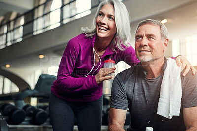 Buy stock photo Happy, fitness and mature couple at a gym for water, break or bonding after morning, cardio or performance. Workout, support or sports people resting at exercise studio for wellness, care or training