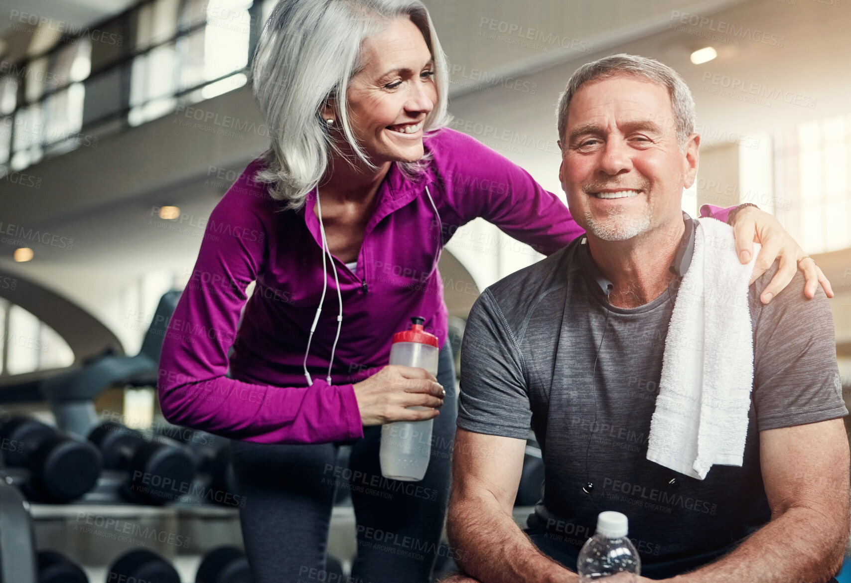 Buy stock photo Happy, fitness and mature friends at gym for water, break or bonding after morning, cardio or performance. Workout, support or sports people resting at exercise studio for wellness, care or training