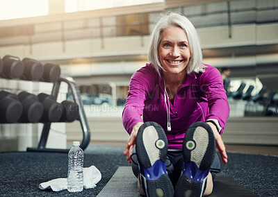 Buy stock photo Feet, portrait or mature fitness woman stretching on gym floor for wellness, training or low impact workout. Sports, warm up or happy person smile with ground exercise for balance or flexibility