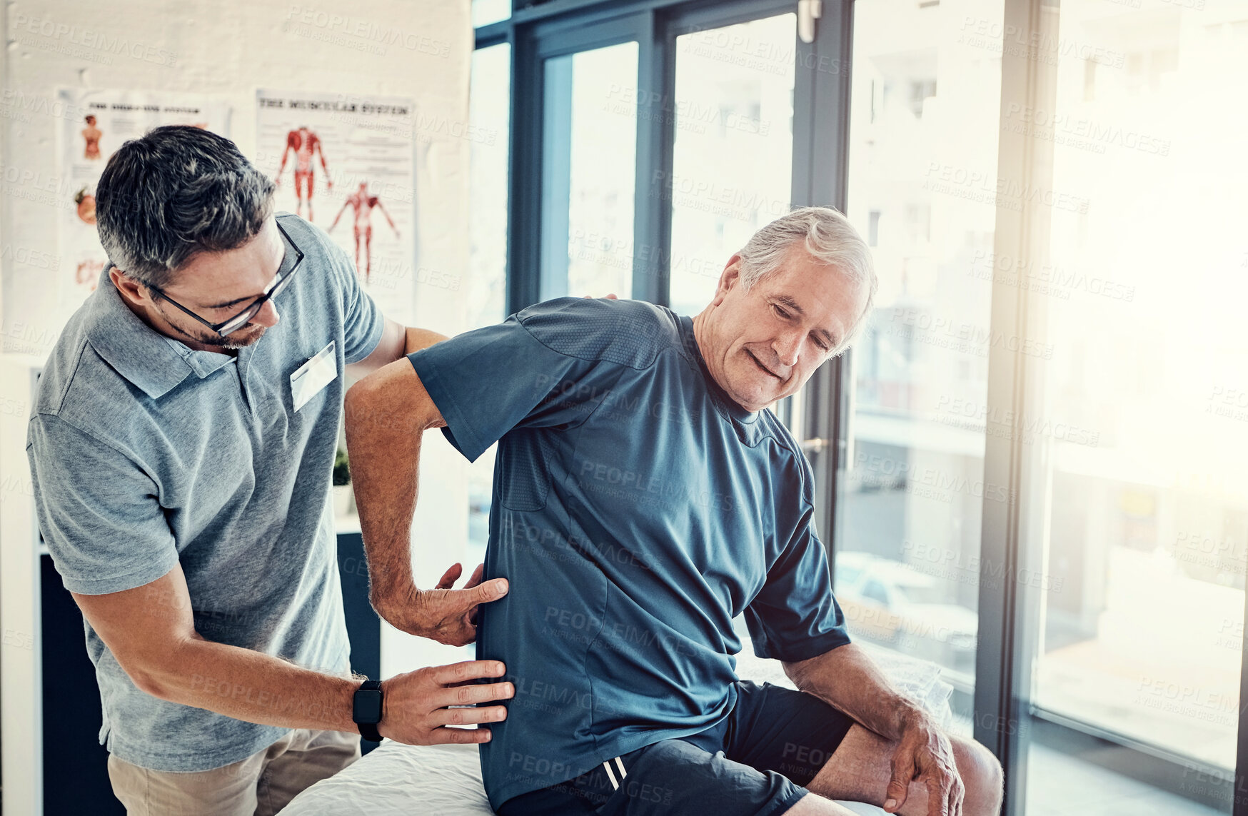 Buy stock photo Physiotherapy, chiropractor and elderly man with back pain for rehabilitation, consulting and exercise. Healthcare, physical therapy and person with patient for medical service, wellness and support