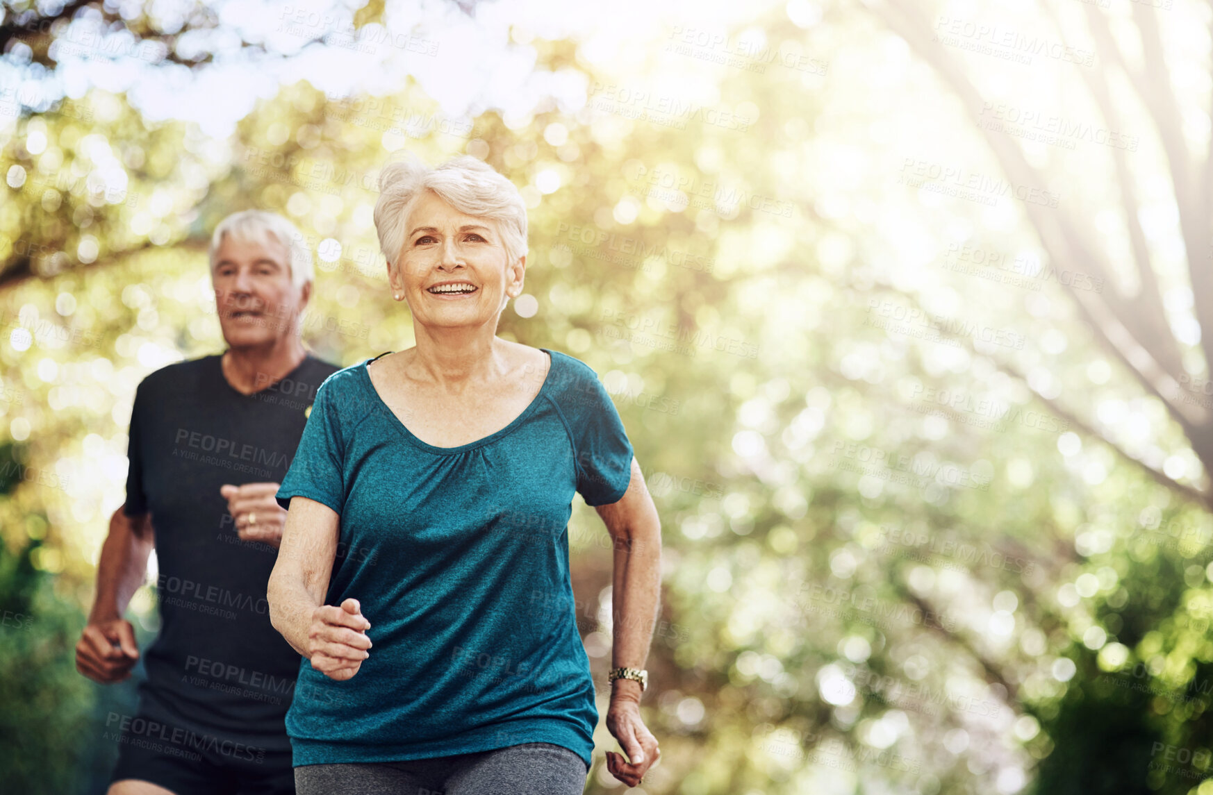 Buy stock photo Running, outdoor and old couple with sunshine, smile and wellness with challenge, healthy and hobby. Park, senior man and mature woman with training, retirement and exercise with fitness and cardio