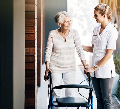 Buy stock photo Caregiver, senior woman and help on walker for support, rehabilitation or medical healthcare outdoor. Happy nurse, walking frame and person with disability at retirement home for recovery or wellness