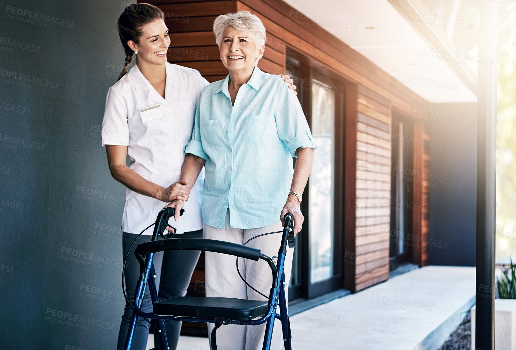 Buy stock photo Senior, woman and nurse outside with walker, movement and wellness care with healthcare employee in nursing home. Rehabilitation, walking and support with caretaker, physical therapy and happy people