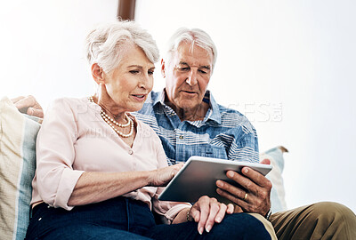 Buy stock photo Tablet, browsing and senior couple in living room in house for streaming online movie on website. Tech savvy, subscription and people in home with networking, app and social media in retirement.