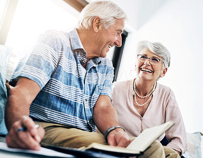 Buy stock photo Writing, notebook and senior couple in home planning for retirement fund, savings and pension. Smile, investment and elderly man and woman with budget notes for bills, mortgage and debt payment.