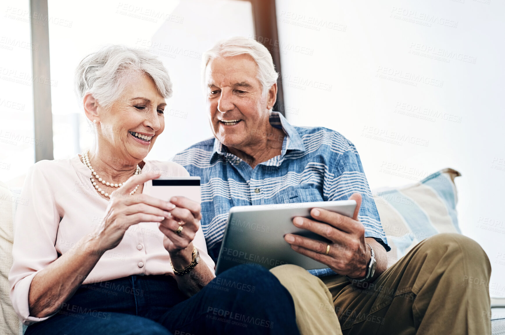 Buy stock photo Senior couple, living room and tablet with credit card on sofa for online shopping, payment and retirement plan. People, happy and couch at home for internet banking, budget and investment or finance