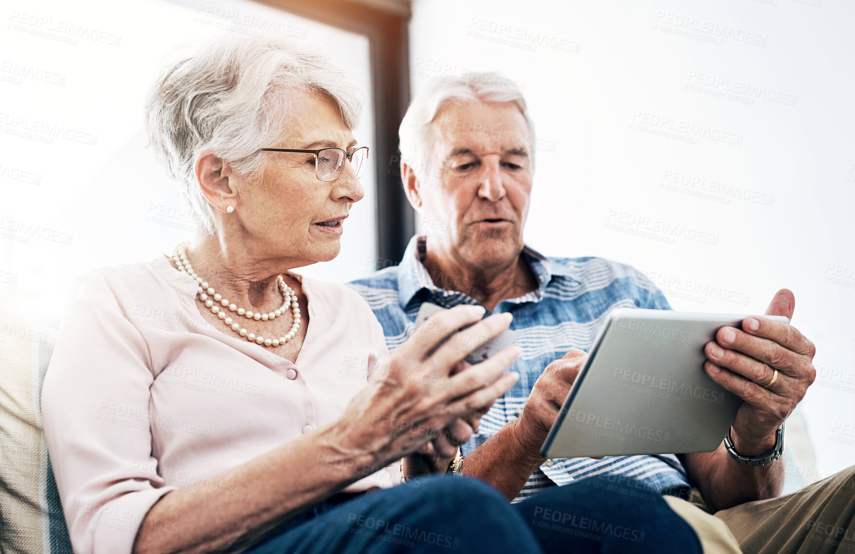 Buy stock photo Mature couple, tablet and browsing with credit card in house for online shopping in living room. Streaming, movies and subscription with internet banking, digital purchase and transaction in home.