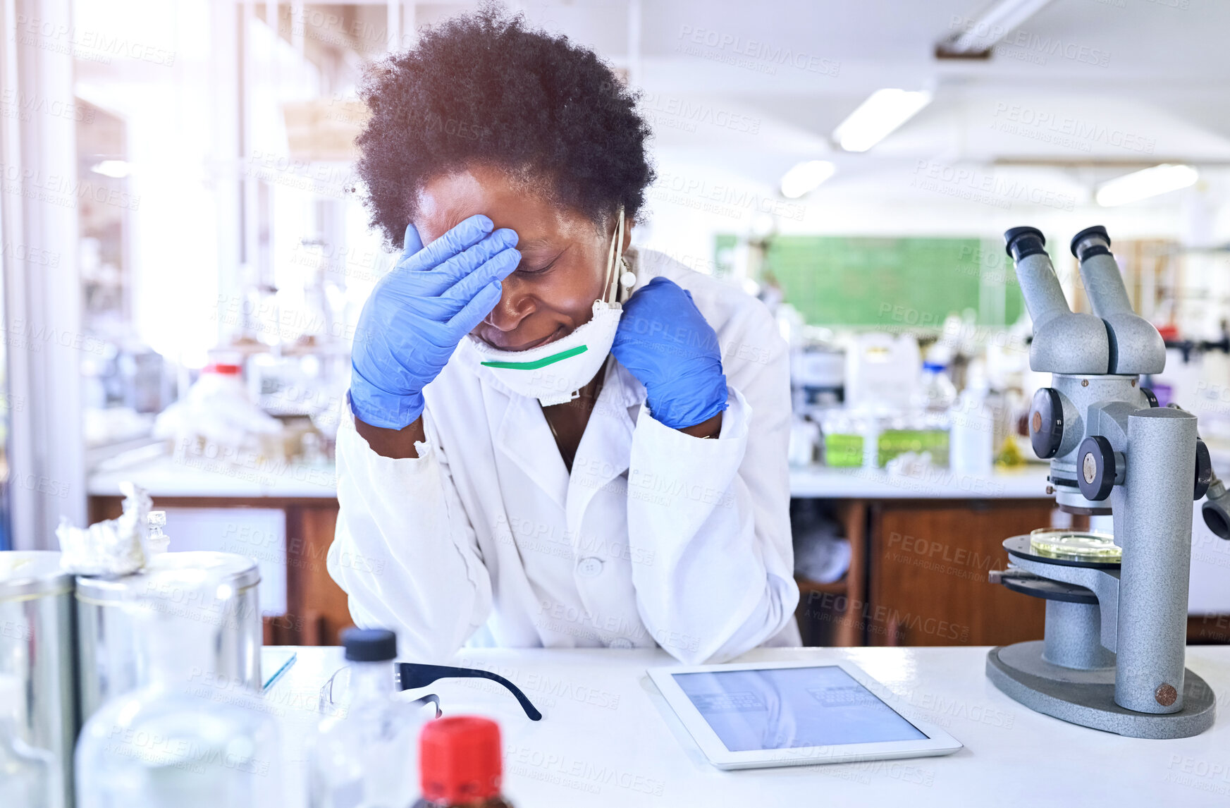 Buy stock photo Medical research, woman and headache with microscope and tablet for problem testing vaccine or medicine. Tired, female person or scientist with gloves and face mask for burnout and fatigue in lab