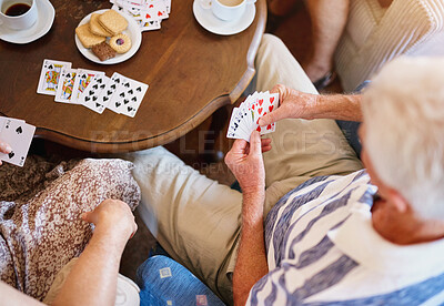 Buy stock photo Elderly man, table and people with playing cards in retirement home for strategy game, bonding and activity. Top view, friends and poker with snack for fun competition, contest and problem solving