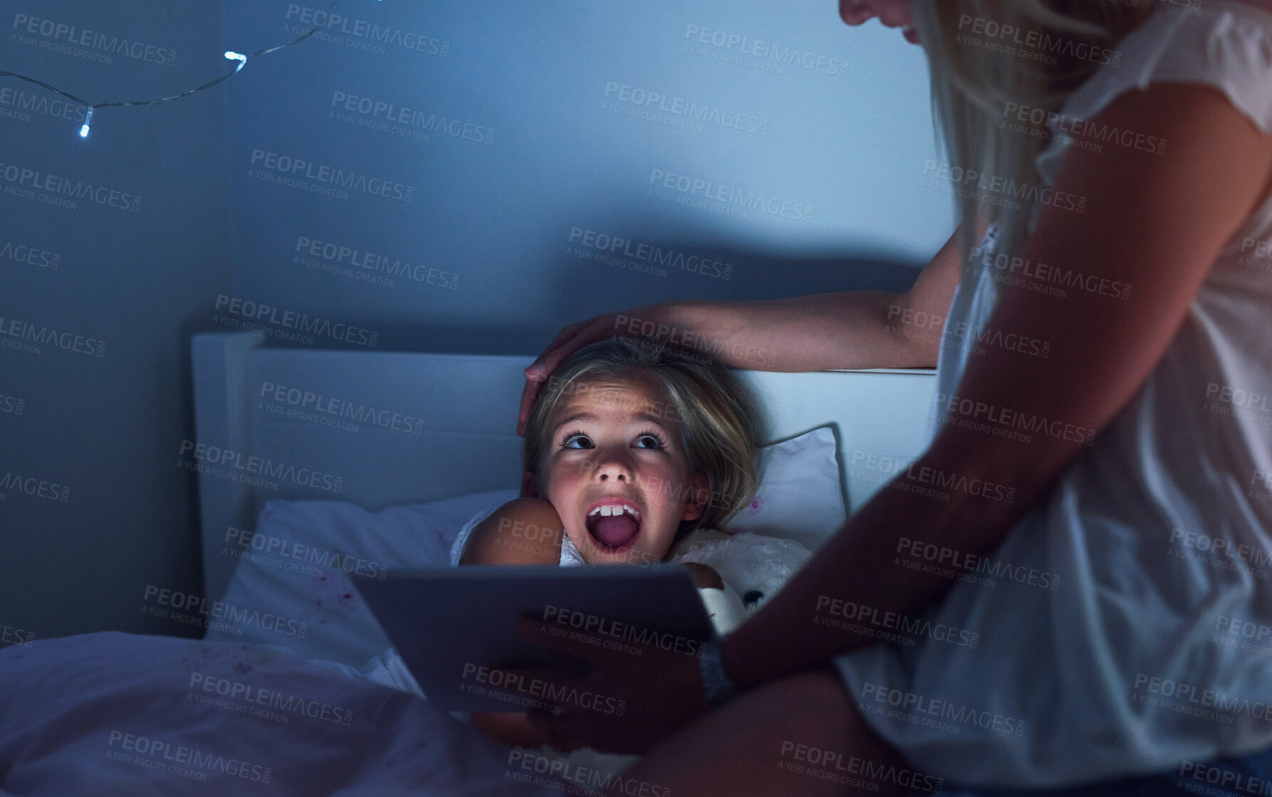 Buy stock photo Mother, daughter and surprise in bedroom with reading story at night, tablet for kids with digital book. Mom, girl child and dark with shocked expression in home for family, wow for video cartoon