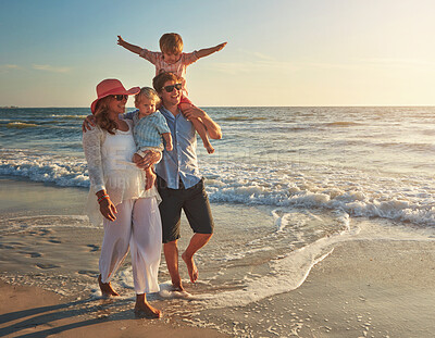 Buy stock photo Happy, family and walking on beach for holiday adventure in summer, bonding and love with freedom in Greece. Woman, man and kids on shoulder travel on ocean, support or relax on tropical vacation 