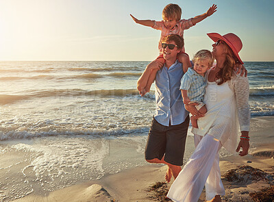 Buy stock photo Beach, kids and sitting on shoulders with family by sea together for holiday, travel or vacation. People, ocean or sky with mother, father and brother siblings walking on coast for sunshine bonding