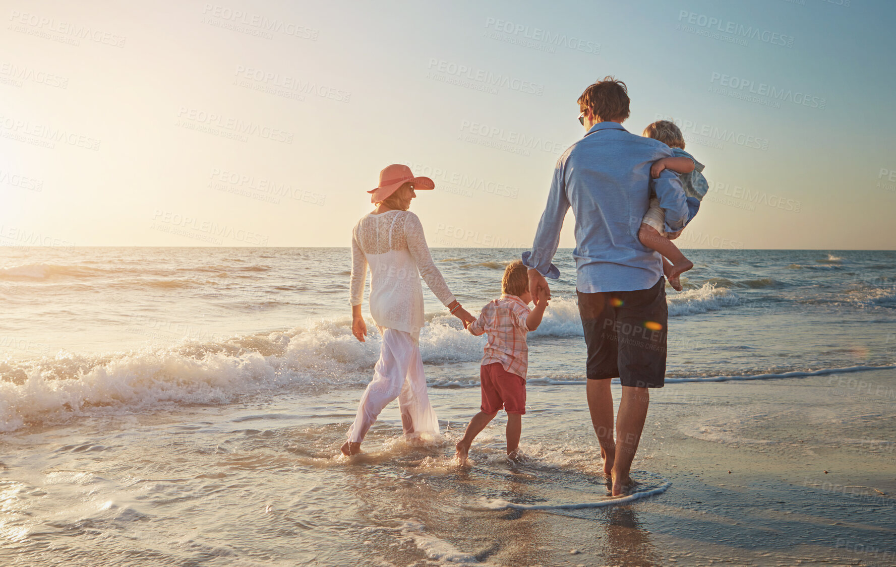 Buy stock photo Family, beach walk and back with dad holding child for fun, relax and adventure on summer holiday. Parents, kids and travel with ocean waves, love embrace and bonding in nature with lens flare