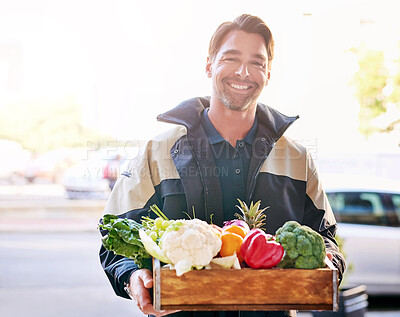 Buy stock photo Delivery man, smile and box of vegetables groceries at front door as courier service for grocery store. Carrier, happy and portrait with package or product of healthy food for customer by supermarket