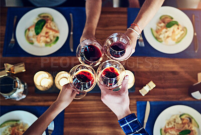 Buy stock photo Food, hands and top view of wine toast by friends in house for birthday celebration, congratulations or reunion event. Glass, cheers or people in solidarity for brunch, meal or drinks at dinner party