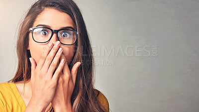 Buy stock photo Gossip space, shock or portrait of woman for announcement mockup in studio on grey background. Wow, fake news or scared female person with surprise, secret or omg reaction with hands to cover mouth