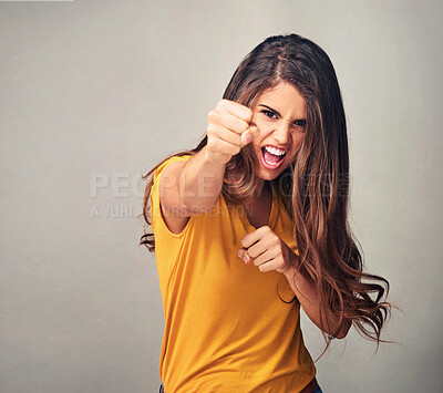 Buy stock photo Fist, fight and portrait of woman in studio for equality, human rights and female empowerment. Strength, justice and person with gesture of power for activism, protest and change on white background