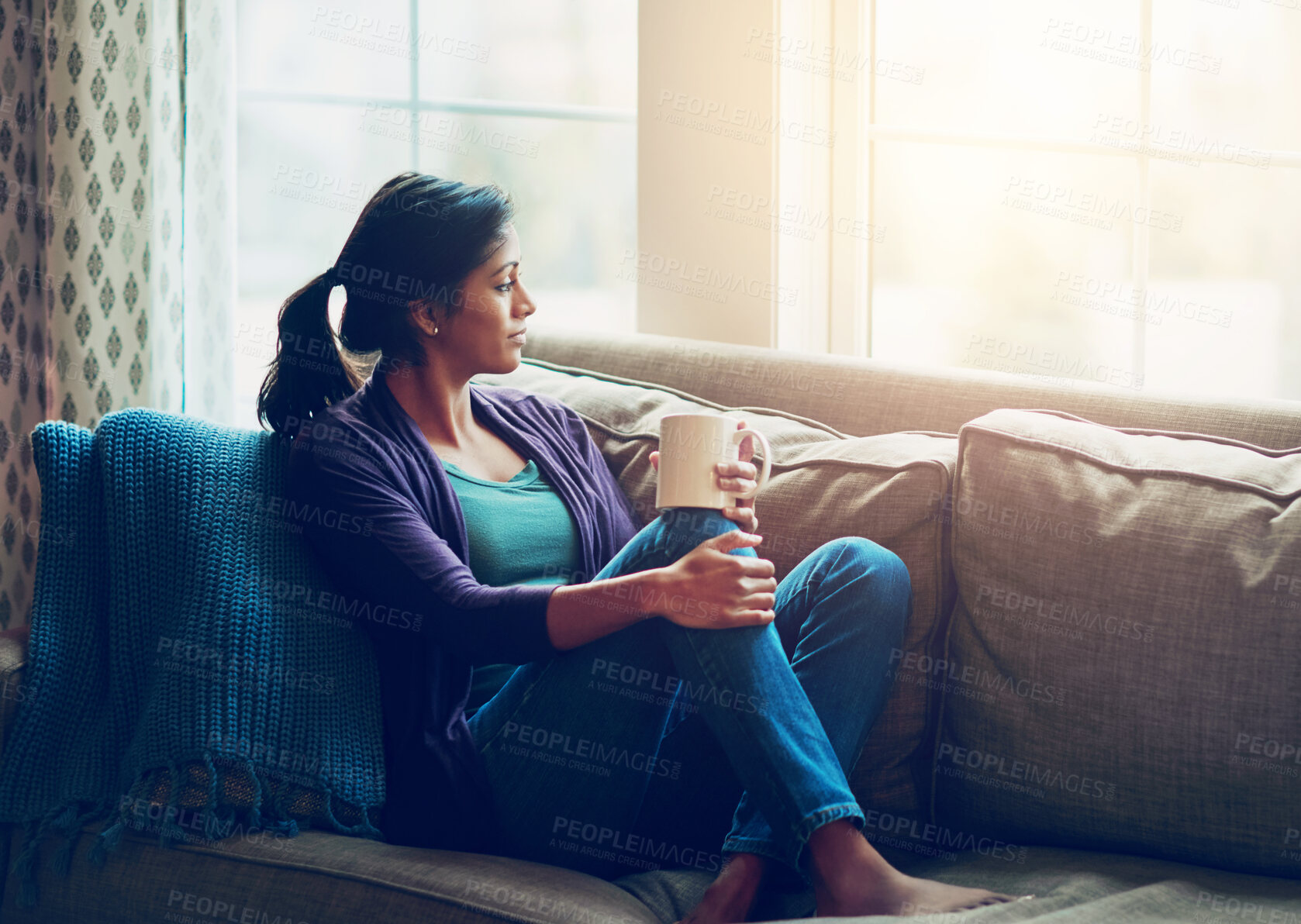 Buy stock photo Thinking, drinking coffee and Indian woman in home living room for morning breakfast, latte and espresso to relax. Tea, dream and person on sofa for peace, calm and planning future decision in house