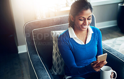 Buy stock photo Morning, phone and smile of woman with coffee, relax and reading of message, online and couch of house. Home, communication and rest on sofa, chat and person with mobile, internet and break in lounge