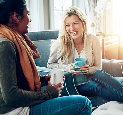 Buy stock photo Women, friends and coffee with conversation on sofa, relax and happy for bonding in living room. People, gossip and talking with diversity, connection and laugh for funny memory with drink in house