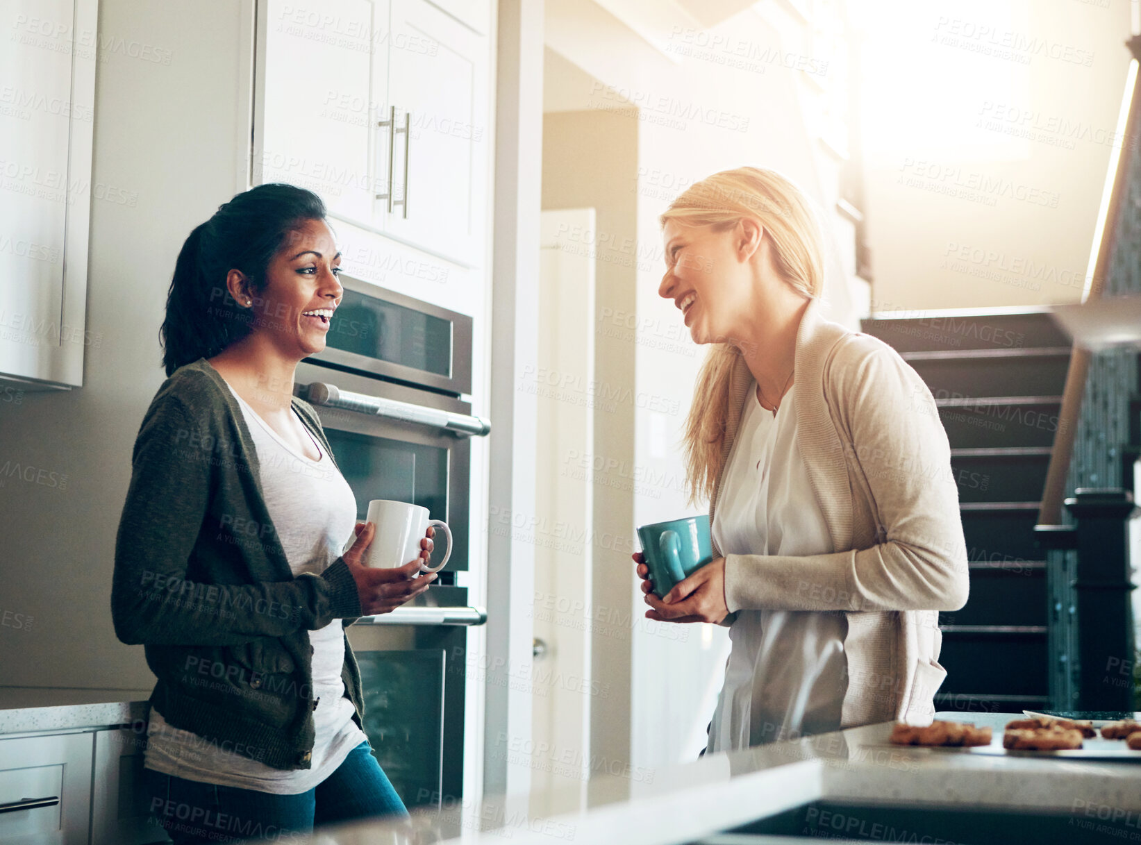 Buy stock photo Coffee, conversation and morning with friends in kitchen of apartment together for bonding. Diversity, drink and funny with happy roommate people in laughing apartment for comedy, humor or joking