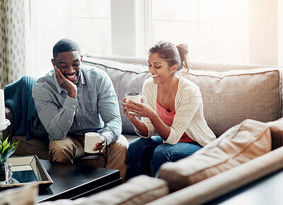 Buy stock photo Couple, relax and coffee on sofa in morning for conversation or talking in living room. Man, woman and discussion at home chat, happy and married with tea for day plan or romantic date in summer