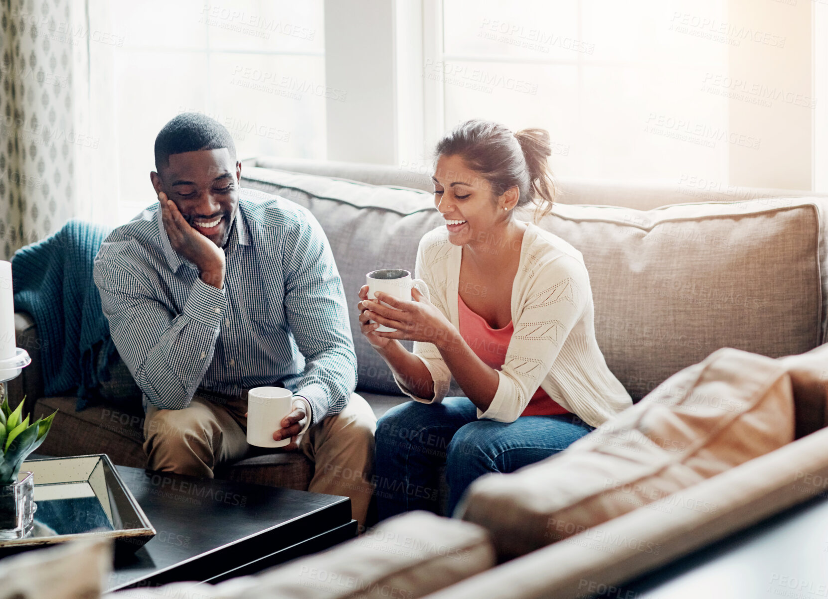 Buy stock photo Couple, relax and coffee on sofa in morning for conversation or talking in living room. Man, woman and discussion at home chat, happy and married with tea for day plan or romantic date in summer