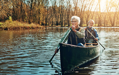 Buy stock photo Lake, sunshine and kayak with old couple, nature and retirement with happiness, getaway trip and vacation. Outdoor, river and mature man with senior woman, rowing and trust with holiday and romance