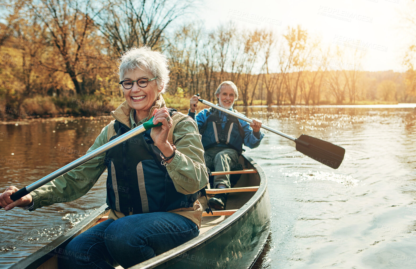 Buy stock photo Lake, rowing and kayak with old couple, nature and retirement with happiness, relax and vacation. Outdoor, river and mature man with senior woman, support and trust with holiday and weekend break