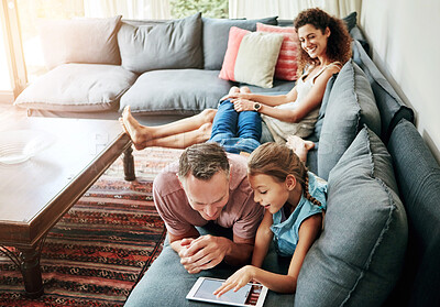 Buy stock photo Mother, father and child with tablet in watching on weekend, break at home for e learning or gaming. Happy people, lounge and relax in together for bonding as parents for growth, development and love