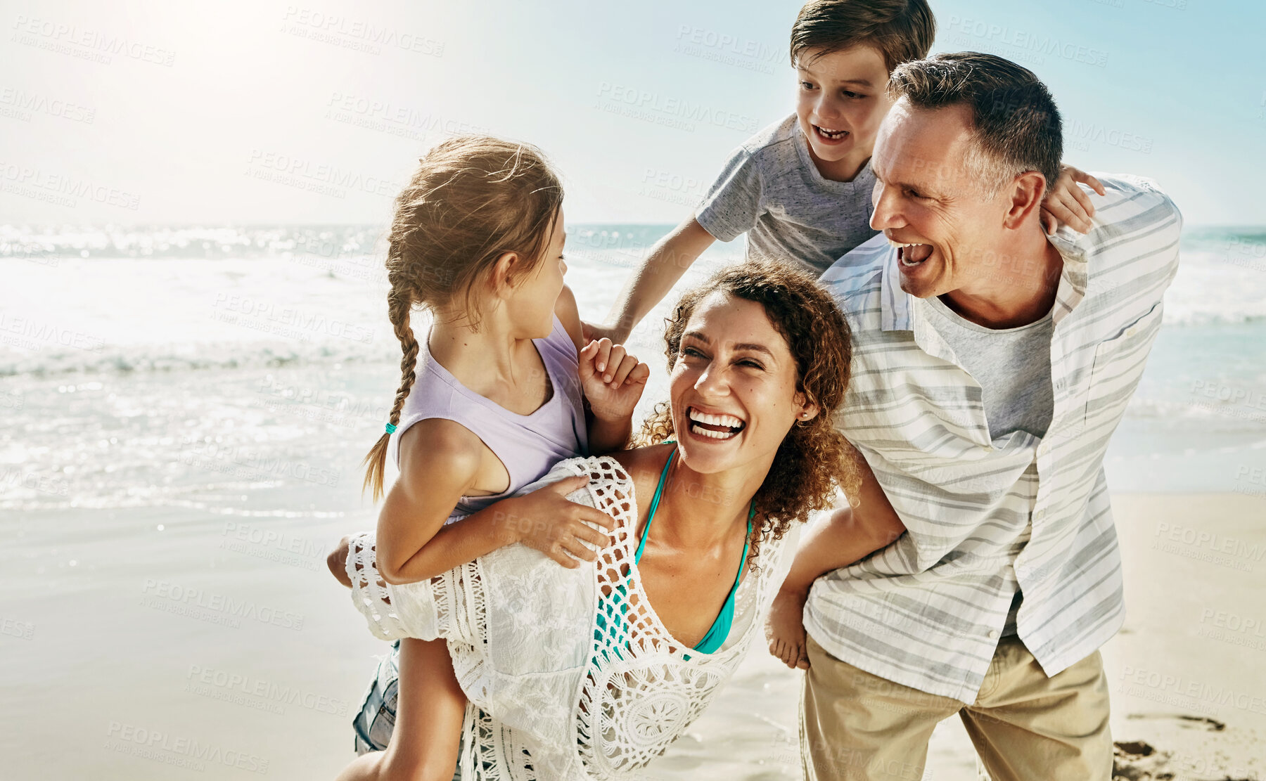 Buy stock photo Beach, family and parents piggy back for holiday, fun and together with children for Australia adventure. Summer, ocean and vacation afternoon with happy mother, father and kids laughing in nature