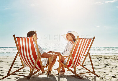 Buy stock photo Couple, relax and sunshine on beach chair for vacation adventure, love and support of partner in summer journey. Happy, woman and man holding hands with ocean freedom, trust and travel in Bali island