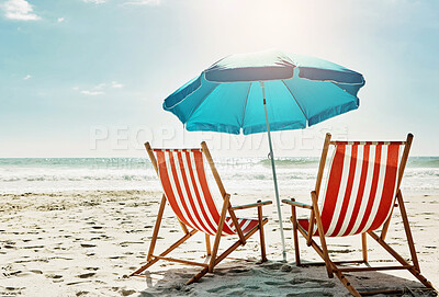 Buy stock photo Rest, relax and beach chairs with umbrella on sand for vacation, holiday or weekend break. Summer, blue sky and seats in nature with water and ocean for peace, travel or tourism in bali getaway