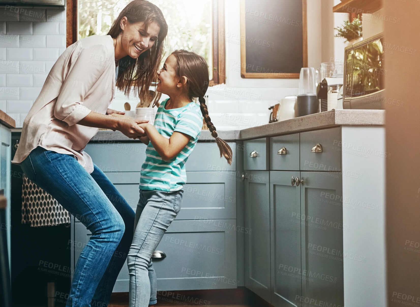 Buy stock photo Dancing, happy and mother with child in kitchen for bonding, fun and listening to music together. Smile, excited and mom teaching girl kid to groove to radio, playlist or song at home in Canada.