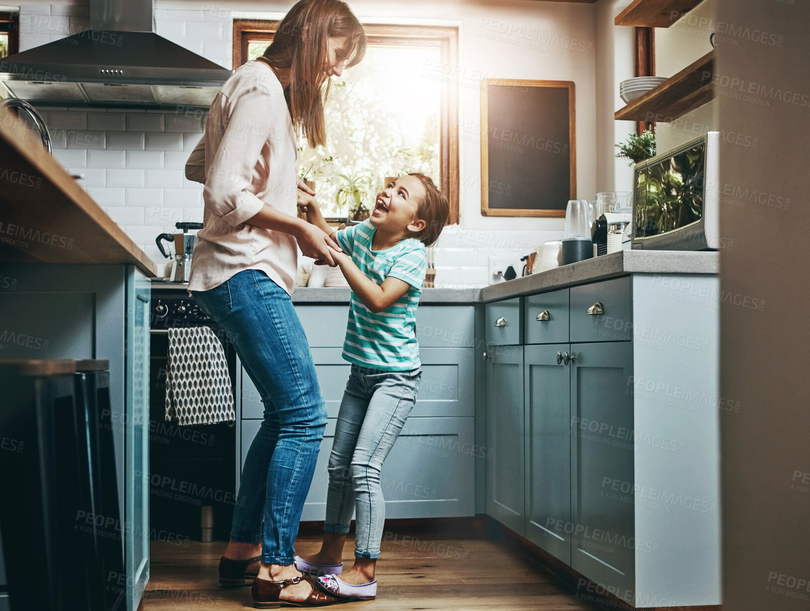 Buy stock photo Dancing, happy and mother with child in kitchen for bonding, fun and listening to music together. Smile, excited and mom teaching girl kid to groove to radio, playlist or song at home in Canada.