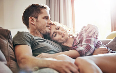 Buy stock photo Couple, relax and home in lounge, love and cozy in marriage, embrace and peace in break and morning. House, man and woman on sofa, together and rest in living room, bonding and smile for relationship