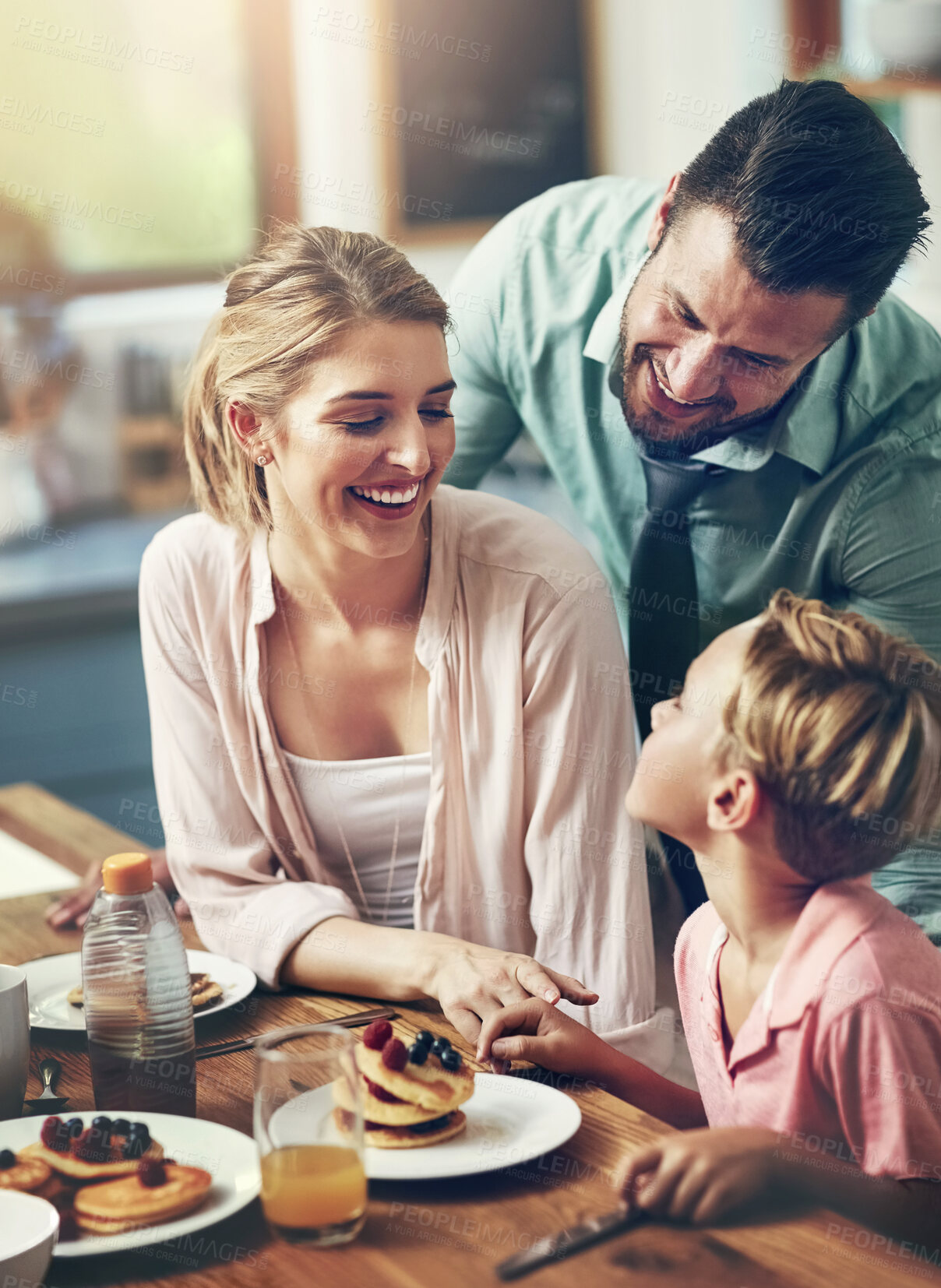 Buy stock photo Home, parents and boy with breakfast, love and happiness in kitchen, bonding together and pancakes. Family, mother and father with kid, healthy food and meal with nutrition, wellness or care in house